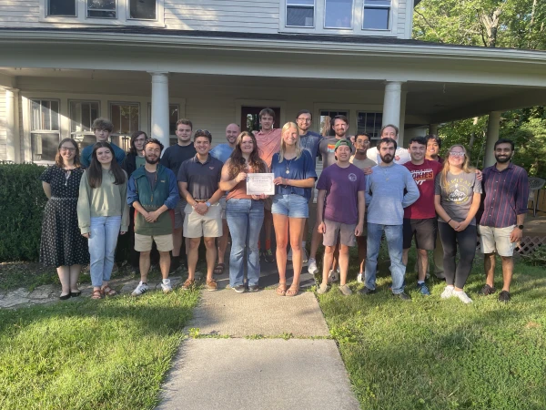 Virginia Tech students with the RISE Award certificate in front of the Virginia Tech Newman House. Credit: Photo courtesy of Virginia Tech Catholic Campus Ministry