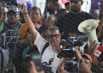 A legal fight is playing out around a Mexican migrant activist accused of human trafficking