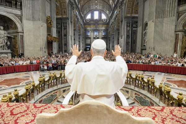 Pope Leo XIV blesses the crowd at his Wednesday general audience in St. Peter’s Basilica on Aug. 13, 2025, at the Vatican. Due to the heat, the pope gave his address in Paul VI Audience Hall but also greeted pilgrims in other locations. Credit: Vatican Media