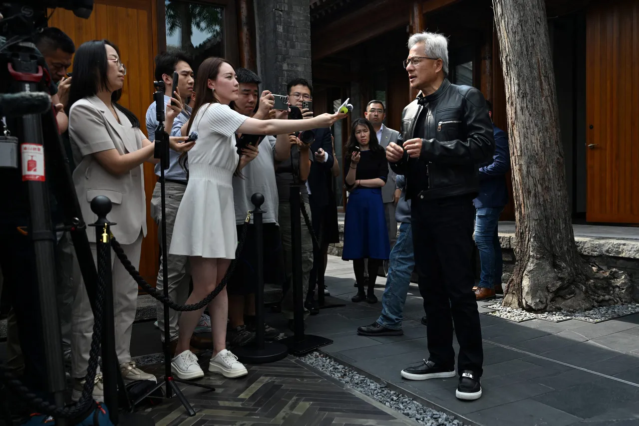 TOPSHOT - Nvidia CEO Jensen Huang speaks to journalists as he arrives for a press conference at a hotel in Beijing on July 16, 2025. (Photo by ADEK BERRY/AFP via Getty Images)