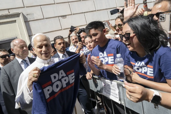 The Muñoz family gives Pope Leo XIV a T-shirt that reads “Da Pope” after Mass in Albano, Italy, on Sunday, July 20, 2025. Credit: Vatican Media