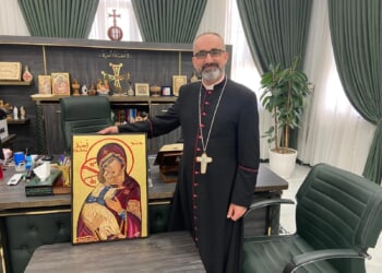 English priest presents Our Lady of Persecuted Christians icon to Iraqi bishop