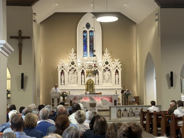 The faithful pray before the altar at Knock Shrine in Knock, Ireland, Friday, Aug. 15, 2025. Credit: Courtney Mares/CNA