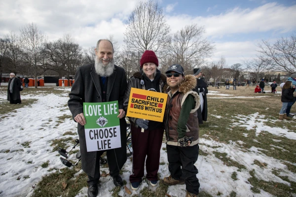 Pardoned by President Trump and released from jail just hours before, Joan Andrews Bell (center) arrived at the 2025 March for Life rally with her husband Chris and son Emiliano Bell. Credit: Jeffrey Bruno