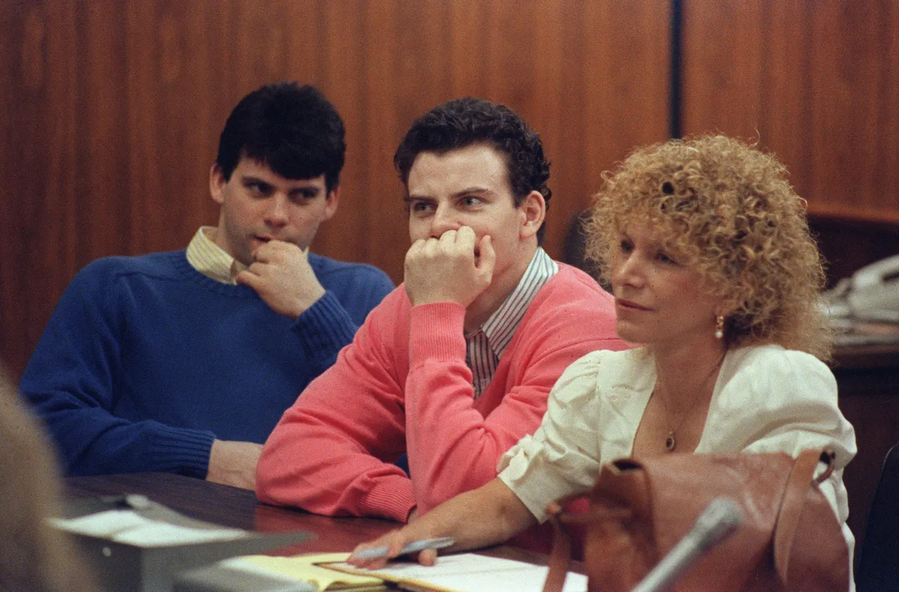 Erik Menendez (C) and his brother Lyle (L) are pictured, on August
