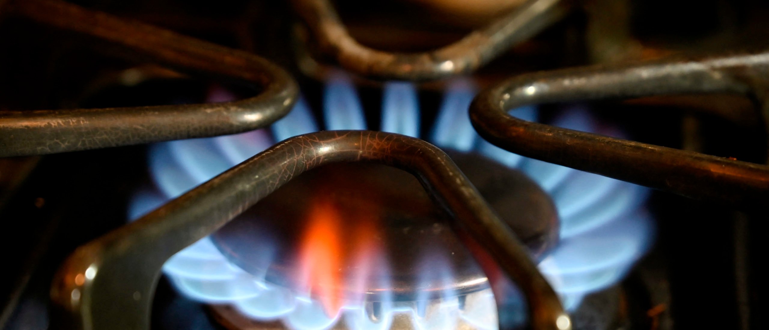 This photo illustration shows blue flames from a gas at a home in Arlington, Virginia on May 3, 2023. (Photo by OLIVIER DOULIERY/AFP via Getty Images)