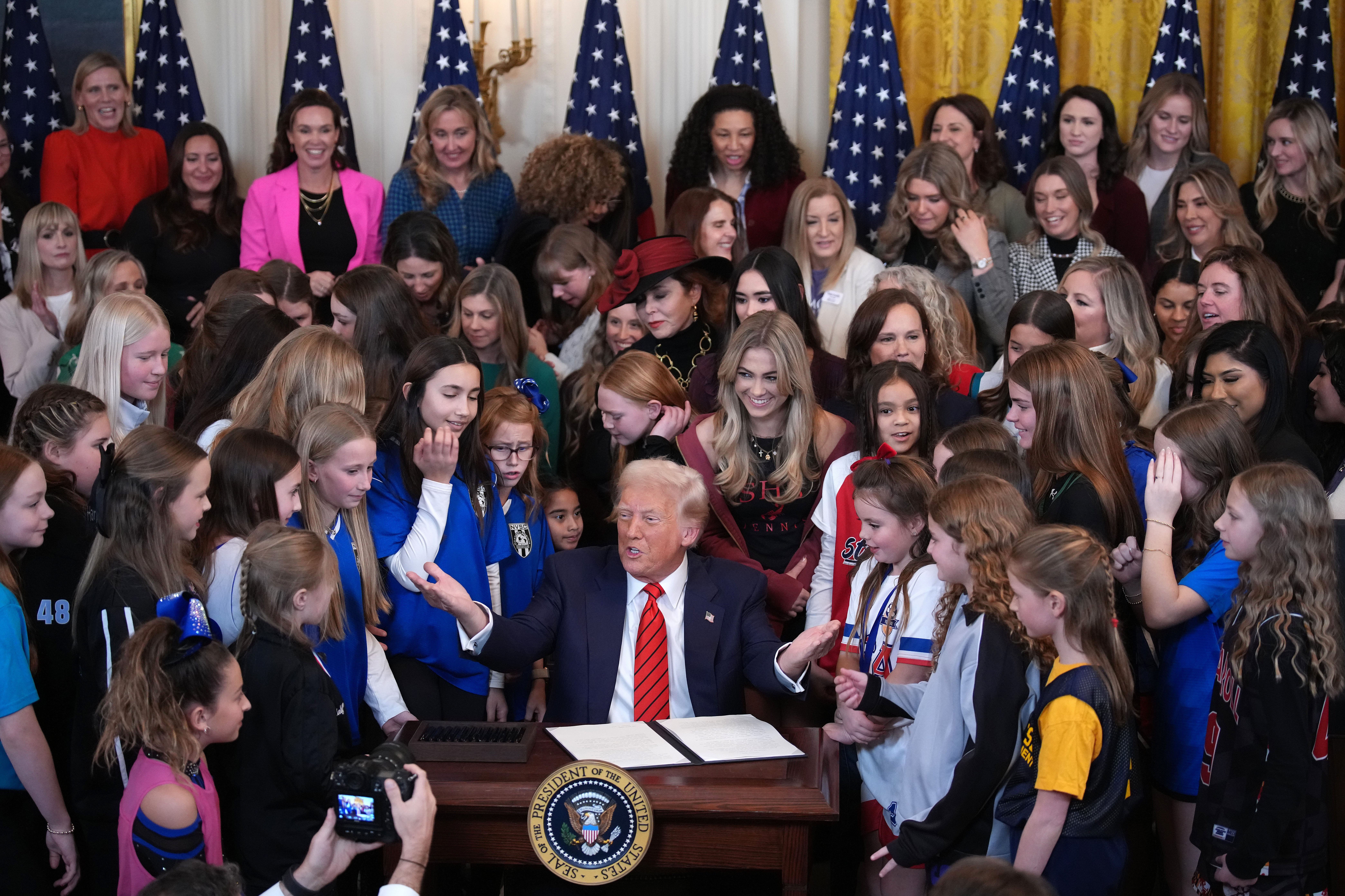 WASHINGTON, DC - FEBRUARY 05: U.S. President Donald Trump joined by women athletes signs the “No Men in Women’s Sports” executive order in the East Room at the White House on February 5, 2025 in Washington, DC. (Photo by Andrew Harnik/Getty Images)