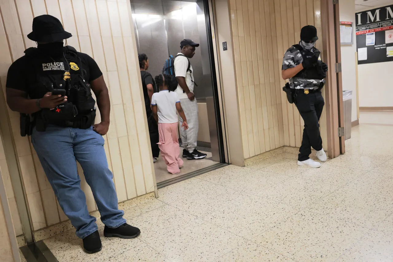 People enter an elevator as federal agents patrol the halls of immigration court at the Jacob K. Javitz Federal Building on July 23, 2025 in New York City. (Photo by Michael M. Santiago/Getty Images)
