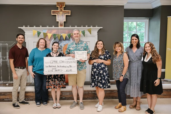 Members of the George Mason University Catholic Campus Ministry receive their RISE Award from the Associates of St. John Bosco. Credit: Courtesy of The Cartiedas