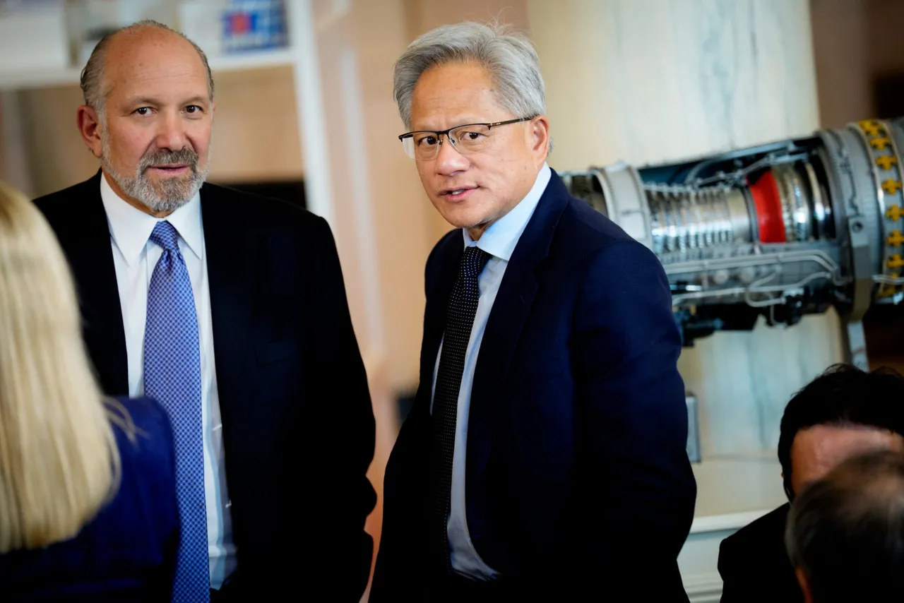 WASHINGTON, DC - APRIL 30: Commerce Secretary Howard Lutnick (L) and Nvidia CEO Jensen Huang (R) speak in the Cross Hall of the White House before an event on 