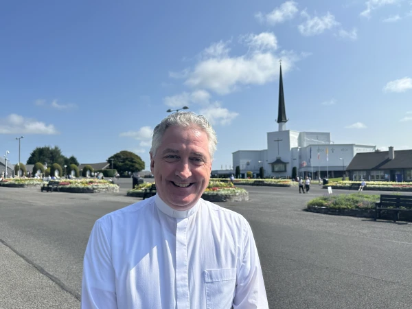 Father Richard Gibbons stands before Knock Shrine in Knock, Ireland, Friday, Aug. 15, 2025. Credit: Courtney Mares/CNA