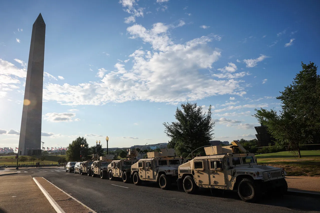 WASHINGTON, DC - AUGUST 12: Military vehicles with the Washington, DC National Guard are parked near the Washington Monument on August 12, 2025 in Washington, DC. The Trump administration has initiated a federal takeover of DC police and mobilized the DC National Guard, saying the moves are necessary to restore order in the city. City officials say they did not know about the plans in advance. (Photo by Win McNamee/Getty Images)