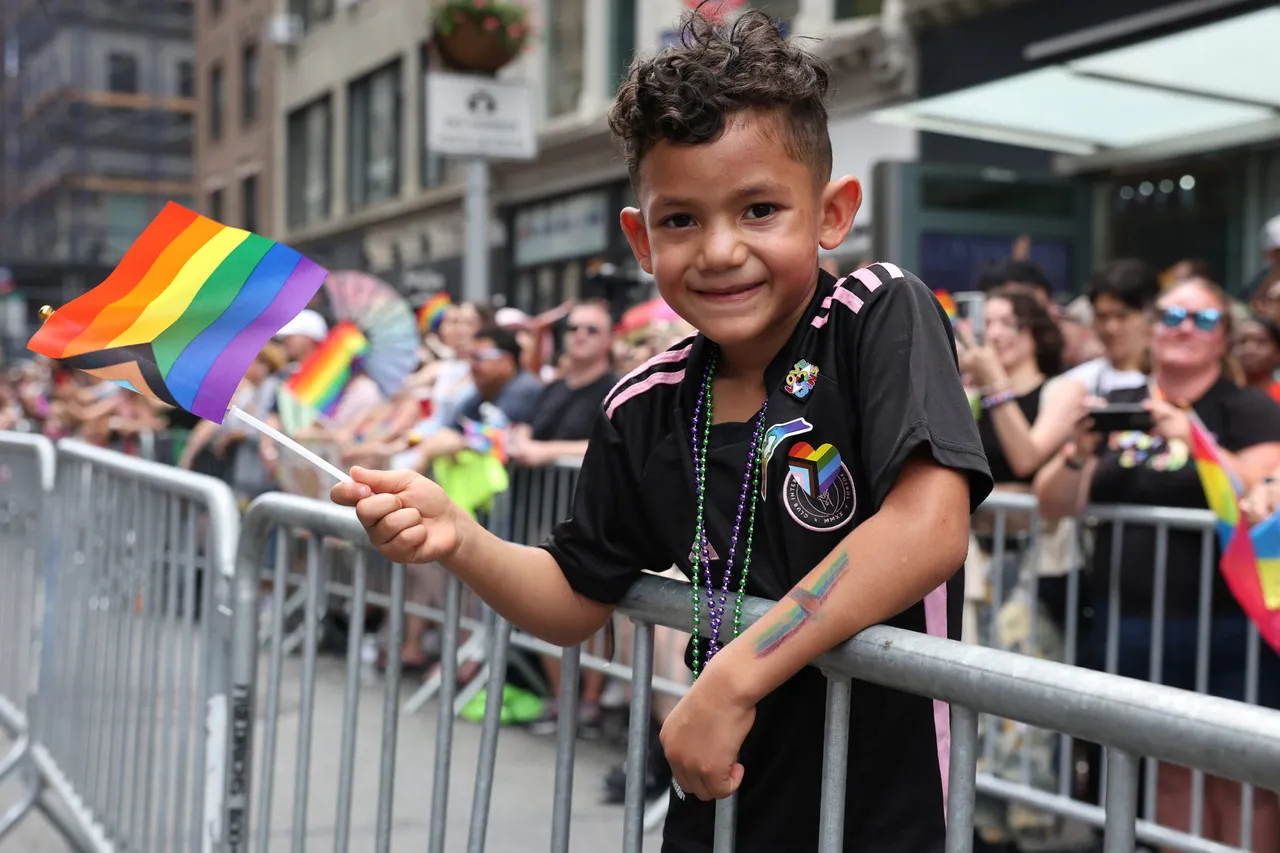 NEW YORK, NEW YORK - JUNE 29: A child waves a flag during the New York Pride March on June 29, 2025. (Photo by Manoli Figetakis/Getty Images)