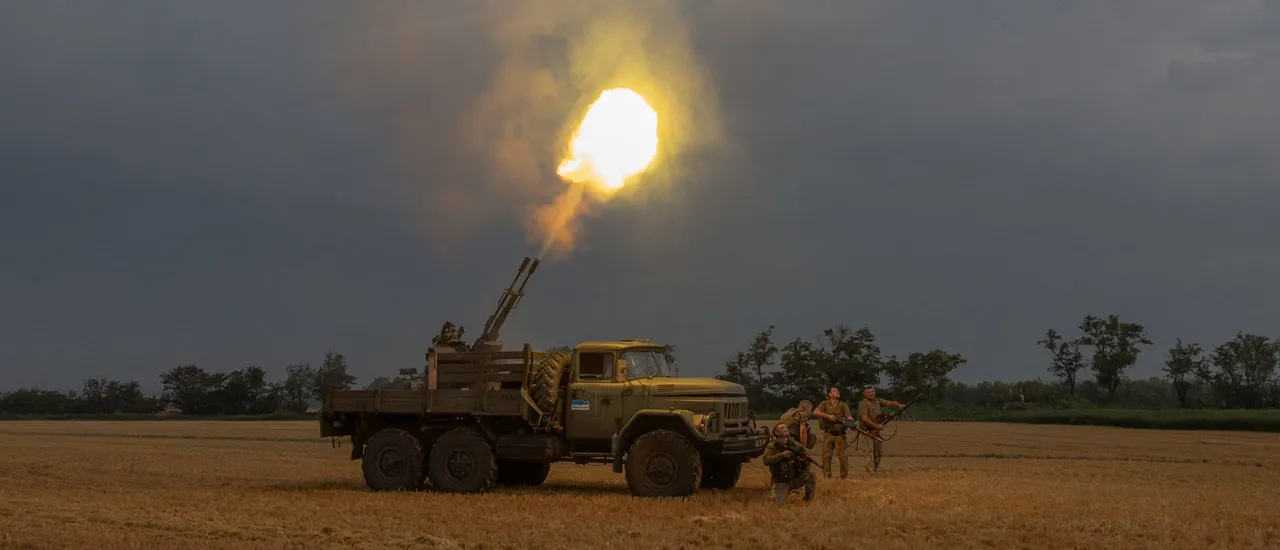 Ukrainian servicemen of the 59th brigade mobile air defence unit fire a Soviet made ZU-23 anti-aircraft twin autocannon towards a Russian drone during an air attack near Pavlograd, Dnipropetrovsk region on July 19, 2025, amid the Russian invasion of Ukraine. Russia's deadly Geran drones, based on the Iranian technology, have been wreaking havoc on Ukraine since the beginning of the war three years ago. But since May 2025, they became more, with hundreds of drones now harassing cities and killing civilians almost daily. (Photo by ROMAN PILIPEY/AFP via Getty Images)