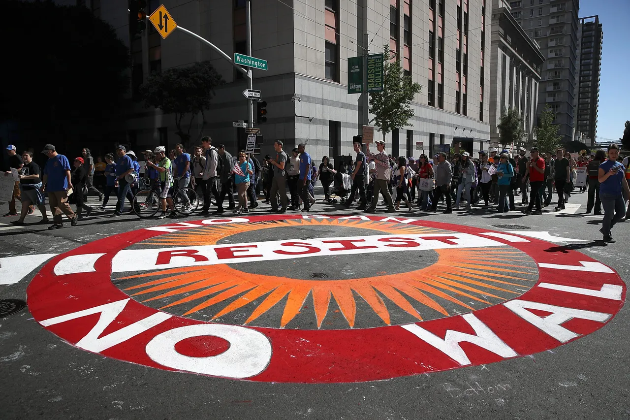 SAN FRANCISCO, CA - MAY 01: Protesters march during a May Day demonstration outside of a U.S. Immigration and Customs Enforcement (ICE) office on May 1, 2017 in San Francisco, California. (Photo by Justin Sullivan/Getty Images)