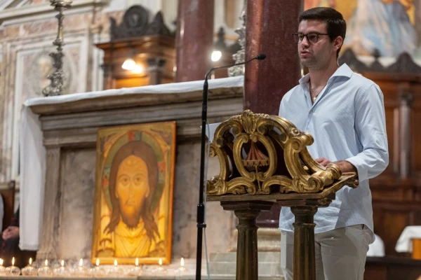 A young Catholic reads the