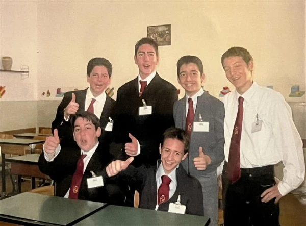 A photo of Carlo Acutis and some of his classmates at the Tommaseo Institute that was pinned to one of the bulletin boards outside of his classroom in the school when CNA's reporting team visited. Credit: Photo courtesy of the Tommaseo Institute
