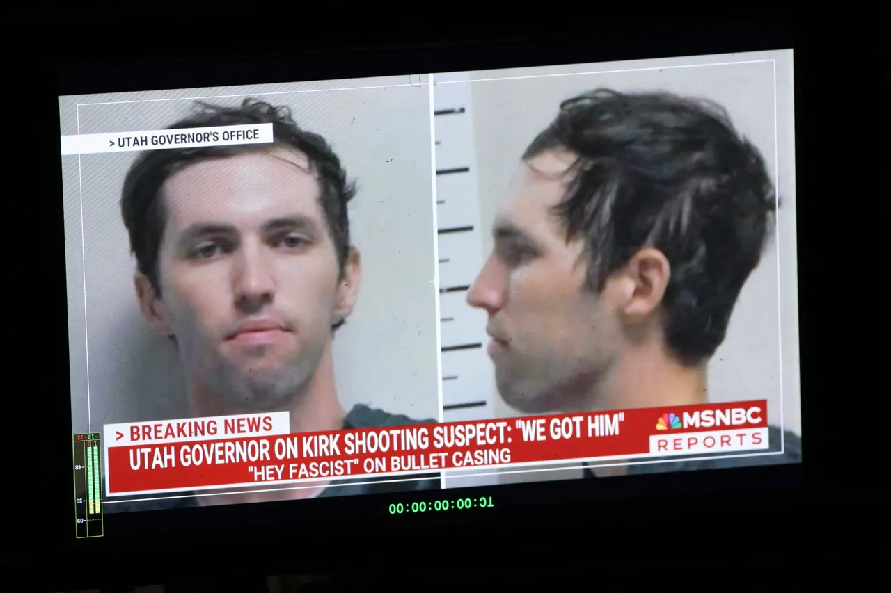 A TV monitor displays a picture of Tyler Robinson, the suspected of killing Charlie Kirk on September 11, in Orem, Utah, on September 12, 2025. US President Donald Trump on Friday announced that the suspect had been taken into custody over the killing of right-wing activist Charlie Kirk after a massive manhunt. (Photo by PATRICK T. FALLON/AFP via Getty Images)