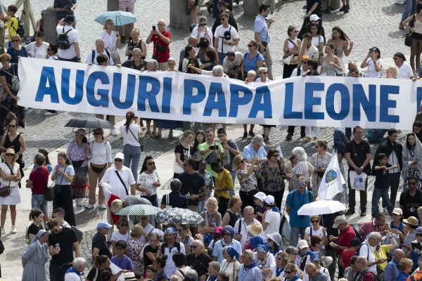 Pilgrims in St. Peter's Square hold a banner congratulating Pope Leo XIV on his 70th birthday, September 14, 2025. Vatican Media