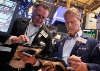 Wall Street holding near its record heights