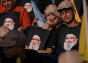 Photos show Hezbollah supporters honoring slain leaders Nasrallah and Safieddine despite PM's ban