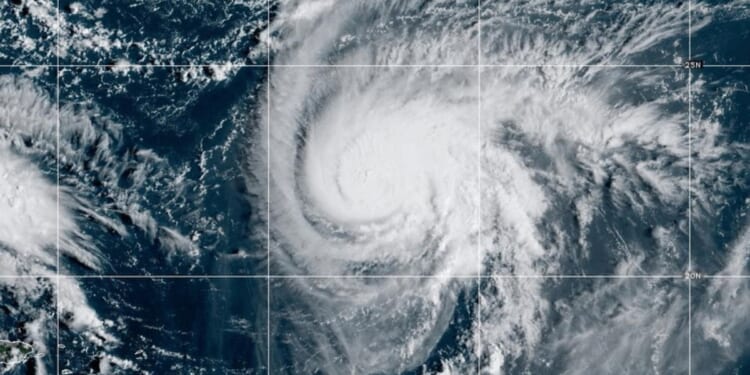 Two tropical storm systems near each other could wind up shielding the Carolinas from damage