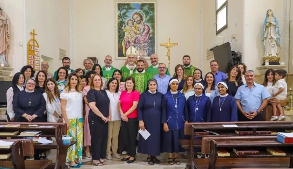 Cardinal Pierbattista Pizzaballa and the priests who concelebrated Mass pause for a photo with the catechism teachers at a Mass on Sept. 27, 2025. Credit: Latin Patriarchate of Jerusalem