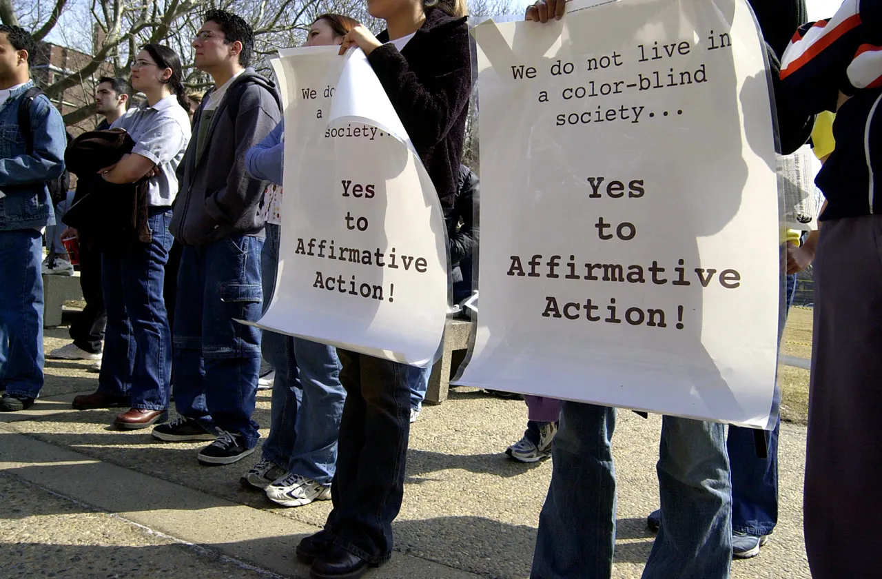 CAMBRIDGE, MA - MARCH 18: Massachusetts Institute of Technology students and activists hold signs during a rally supporting affirmative action held at the MIT student center March 18, 2003 in Cambridge, Massachusetts. Student activists are concerned about possible changes to the way affirmative action affects the educational system. (Photo by Douglas McFadd/Getty Images)