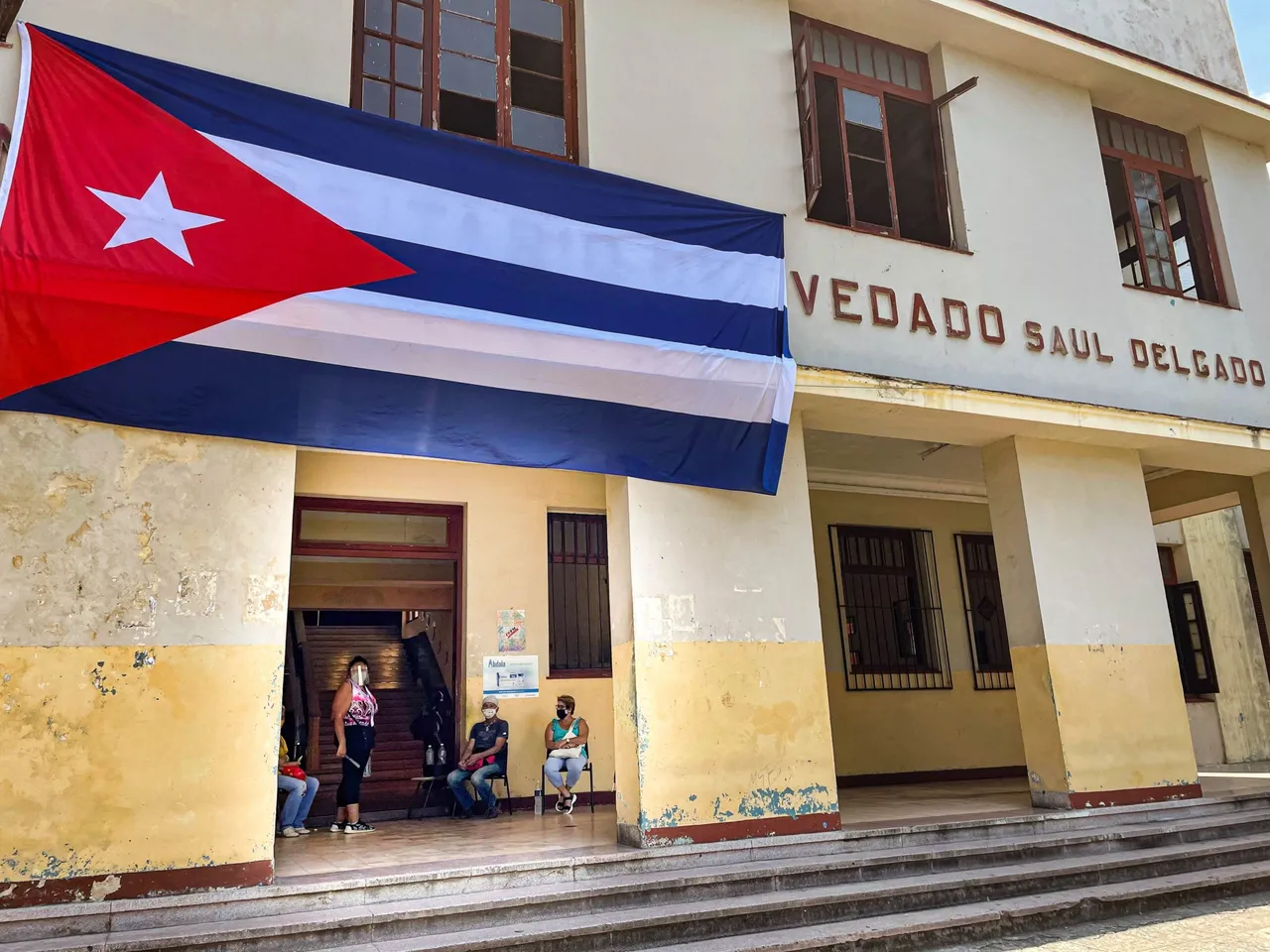 Workers and teachers of the Saul Delgado pre-university. (Photo by KATELL ABIVEN/AFP via Getty Images)