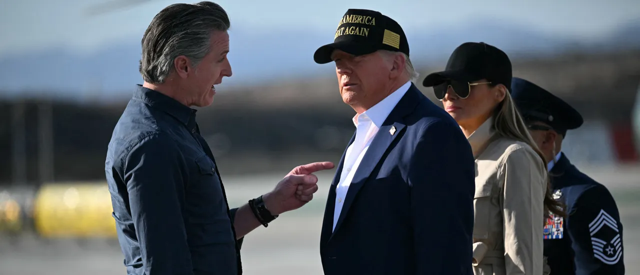 US President Donald Trump and First Lady Melania Trump are greeted by California Governor Gavin Newsom upon arrival at Los Angeles International Airport in Los Angeles, California, on January 24, 2025, to visit the region devastated by the Palisades and Eaton fires. (Photo by MANDEL NGAN/AFP via Getty Images)