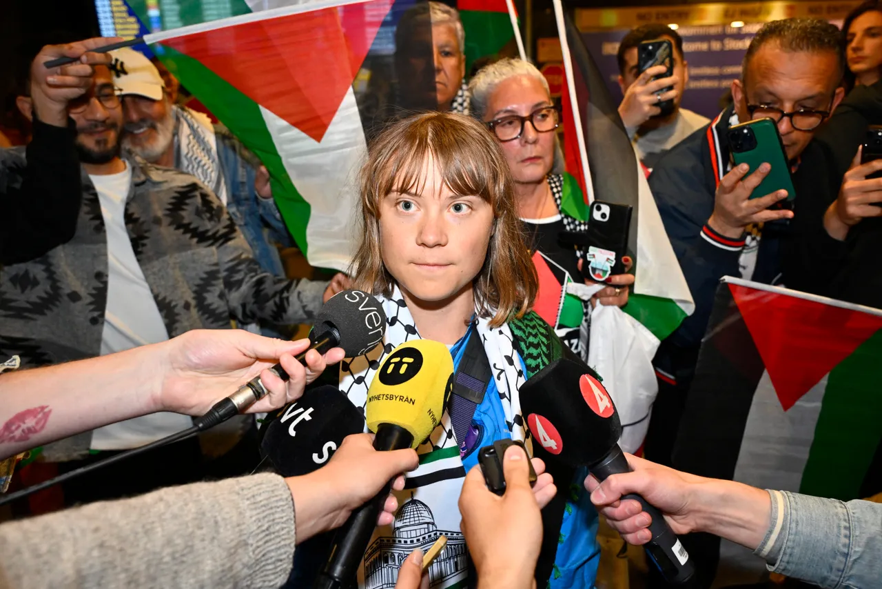 Swedish campaigner Greta Thunberg (C) talks to journalists as she arrives at Stockholm-Arlanda airport, outside Stockholm, on June 10, 2025. (Photo by ANDERS WIKLUND/TT NEWS AGENCY/AFP via Getty Images)
