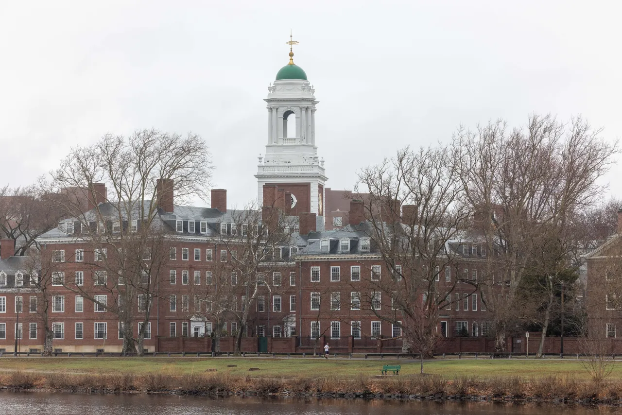CAMBRIDGE, MASSACHUSETTS - MARCH 17: A person runs past Elliot House at Harvard University on March 17, 2025 in Cambridge, Massachusetts. Harvard University announced free tuition for students from families that make under $200K a year. (Photo by Scott Eisen/Getty Images)