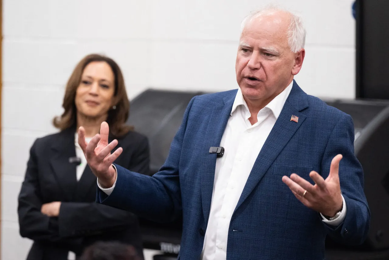 Democratic presidential candidate US Vice President Kamala Harris listen to her running mate, Governor Tim Walz, speak during a visit with members of the marching band at Liberty County High School in Hinesville, Georgia, August 28, 2024, as they travel across Georgia for a 2-day campaign bus tour. (Photo by SAUL LOEB / AFP) (Photo by SAUL LOEB/AFP via Getty Images)