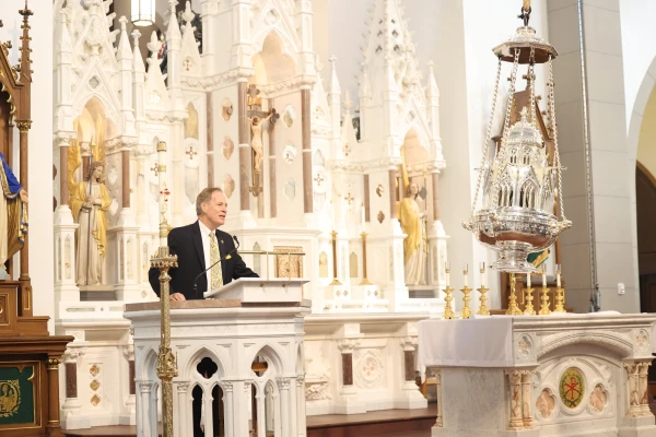 Seeing the giant thurible at the Cathedral of Santiago de Compostela gave Timothy O'Donnell, speaking here at the chapel, the idea to reproduce such a symbol of faith in the college's chapel. Credit: Photo courtesy of Christendom College