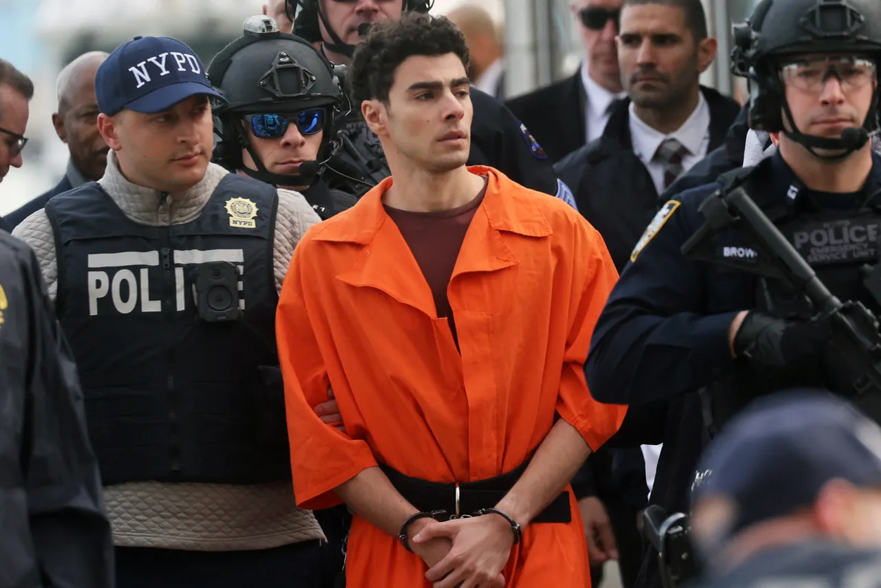 NEW YORK, NEW YORK - DECEMBER 19: Luigi Mangione, suspect in the killing of UnitedHealthcare CEO Brian Thompson in New York City, arrives at a heliport with members of the NYPD on December 19, 2024 in New York City. The 26-year-old was arrested in Pennsylvania on December 9 after being spotted at a McDonald's in Altoona amid a national manhunt. Mangione also appeared in a Pennsylvania court on forgery and firearms charges today, where he waived extradition to New York after being indicted on 11 charges including first-degree murder in furtherance of terrorism. (Photo by Spencer Platt/Getty Images)