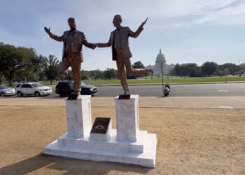 Statue of Trump and Epstein frolicking hand in hand erected on the National Mall