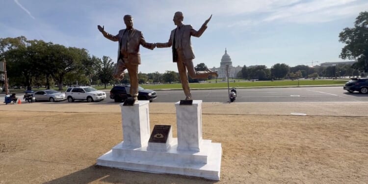 Statue of Trump and Epstein frolicking hand in hand erected on the National Mall