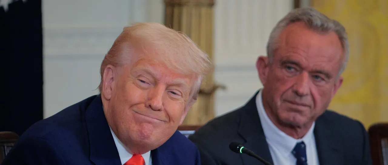 WASHINGTON, DC - MAY 22: U.S. President Donald Trump and Health and Human Services Secretary Robert F. Kennedy Jr. attend an event introducing a new Make America Healthy Again Commission report in the East Room of the White House on May 22, 2025 in Washington, DC. The commission, which is tasked with studying the potential causes for the