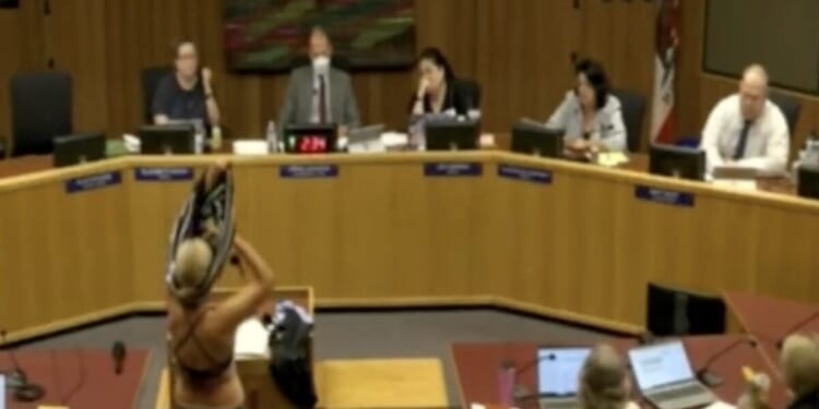 Woman strips at California school board meeting to protest trans locker room policies