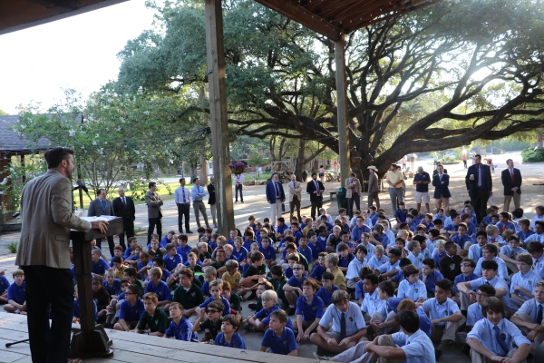 Hebert speaks to the boys on the first day of school as the faculty looks on. Credit: Courtesy of Western Academy
