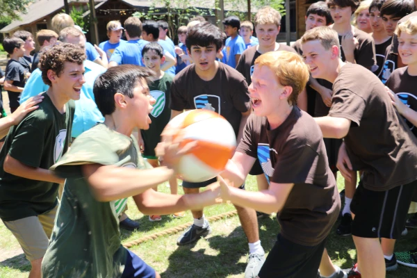 Boys cheer their teammates on as the houses compete in a game of 
