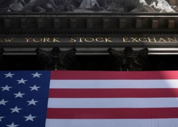 Wall Street hovers near all-time highs with solid performances from top companies