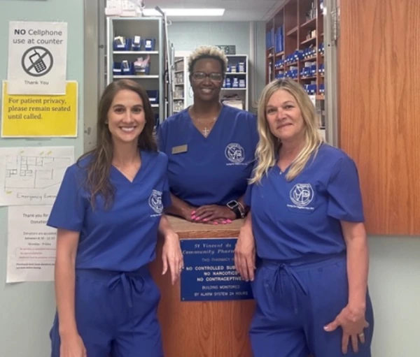 Society of St. Vincent de Paul pharmacist Kellie Elisar (left) and team at the St. Vincent de Paul of Baton Rouge Charitable Pharmacy on June 24, 2025. Credit: Photo courtesy of Society of St. Vincent de Paul