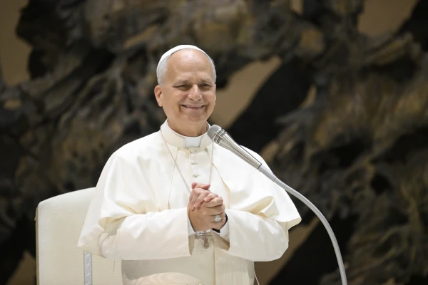 Pope Leo XIV smiles during an audience with religious sisters and brothers, and other members of consecrated life, in the Paul VI Hall at the Vatican on Oct. 10, 2025. Credit: Vatican Media