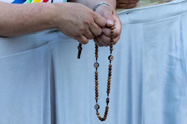 A pilgrim prays the rosary at a Marian vigil in St. Peter's Square, Rome, Saturday, Oct. 11, 2025. Credit: Daniel Ibáñez/CNA