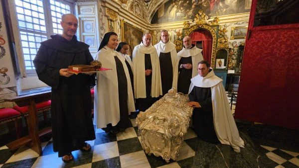 Religious men and women are present at the opening of the tomb of St. Teresa of Ávila. Credit: Order of Carmel