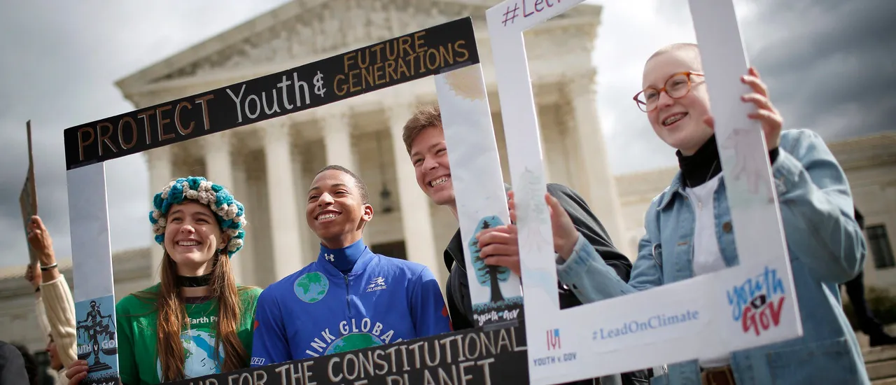 Protesters attend a rally outside the U.S. Supreme Court held by the group Our Children’s Trust October 29, 2018 in Washington, DC. (Photo by Win McNamee via Getty Images)