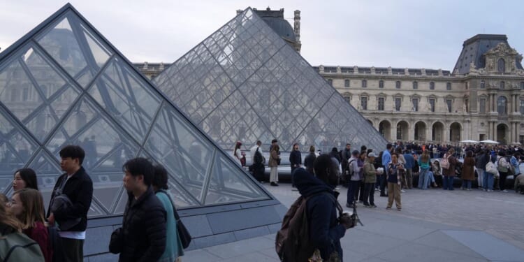 The Louvre reopens three days after one of the biggest museum heists of the century
