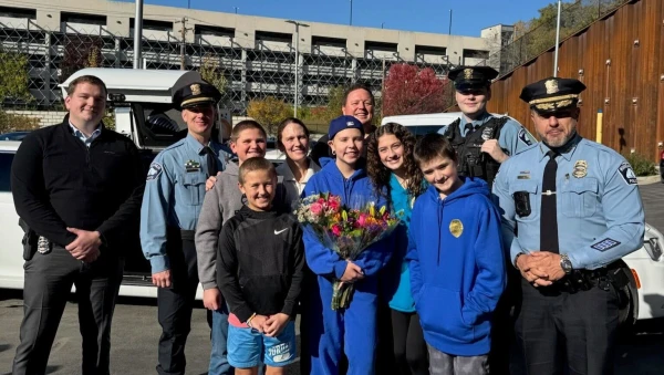 Sophia Forchas smiles alongside Police Chief Brian O’Hara, other police officers, and her family on Oct. 23, 2025. Credit: Photo courtesy of the Forchas family