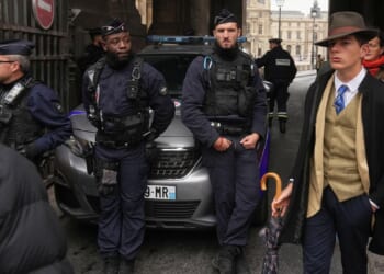 Inspector Clouseau? The mystery man in an AP photo after the Louvre jewel heist creating a buzz